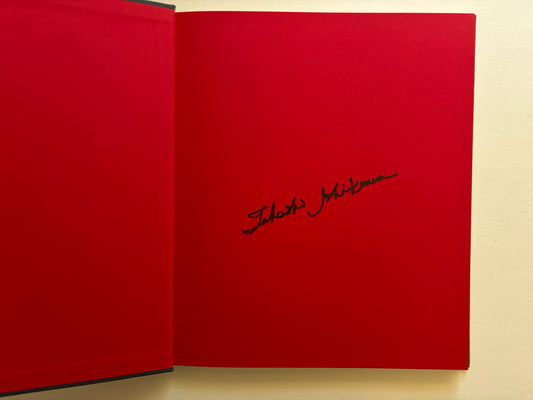 Red signed endpaper inside Naked City Varanasi by Takeshi Ishikawa.