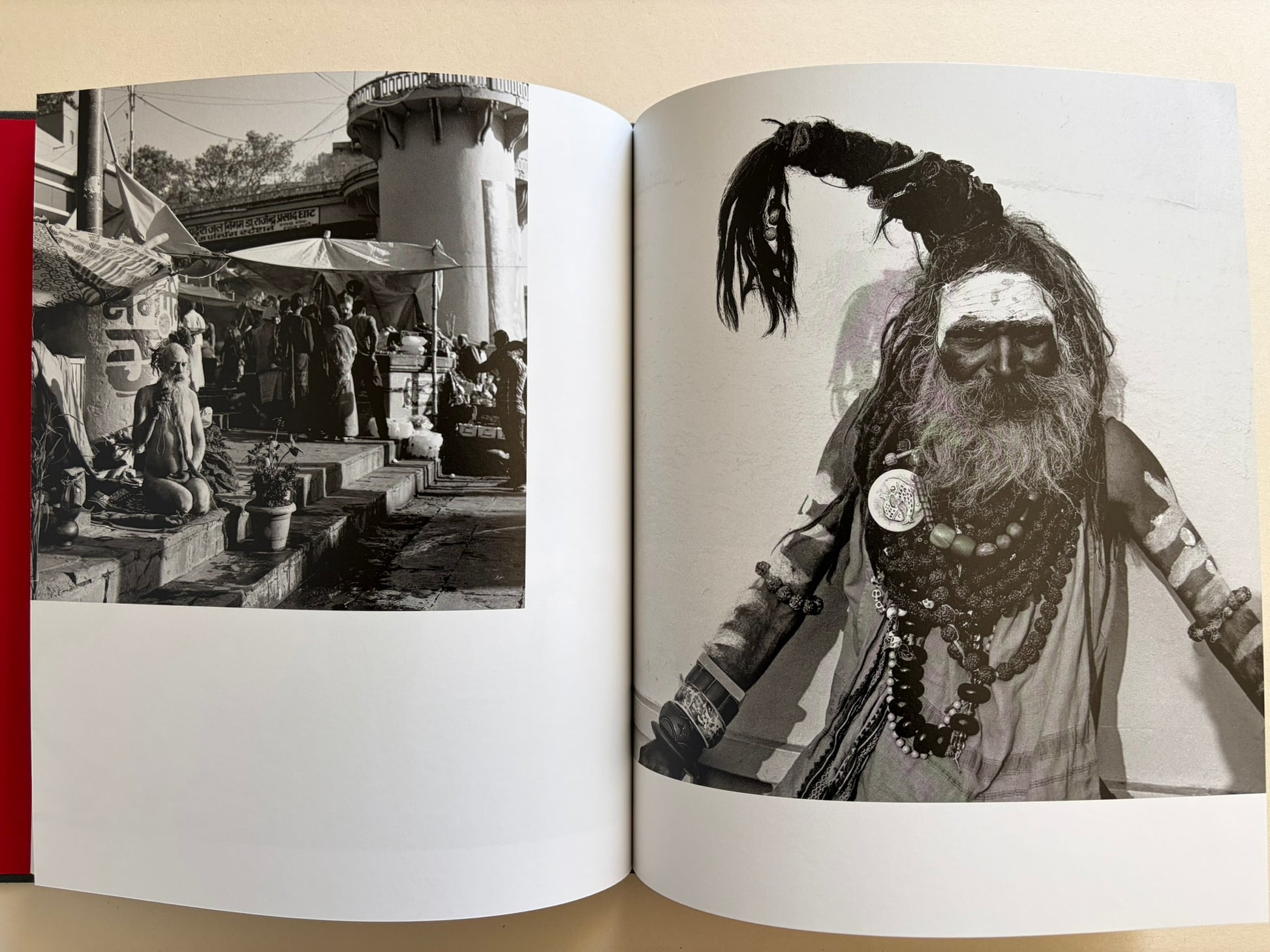 Interior spread from Naked City Varanasi showing a street scene at the ghats and a close portrait of a bearded sadhu.