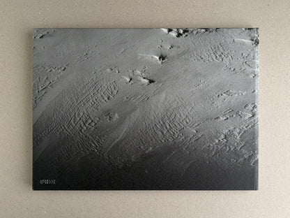 New Land: Pre-Hokkaido Landscapes by Toshiki Nakanishi, front cover with a monochrome aerial landscape image and small title mark at lower left.