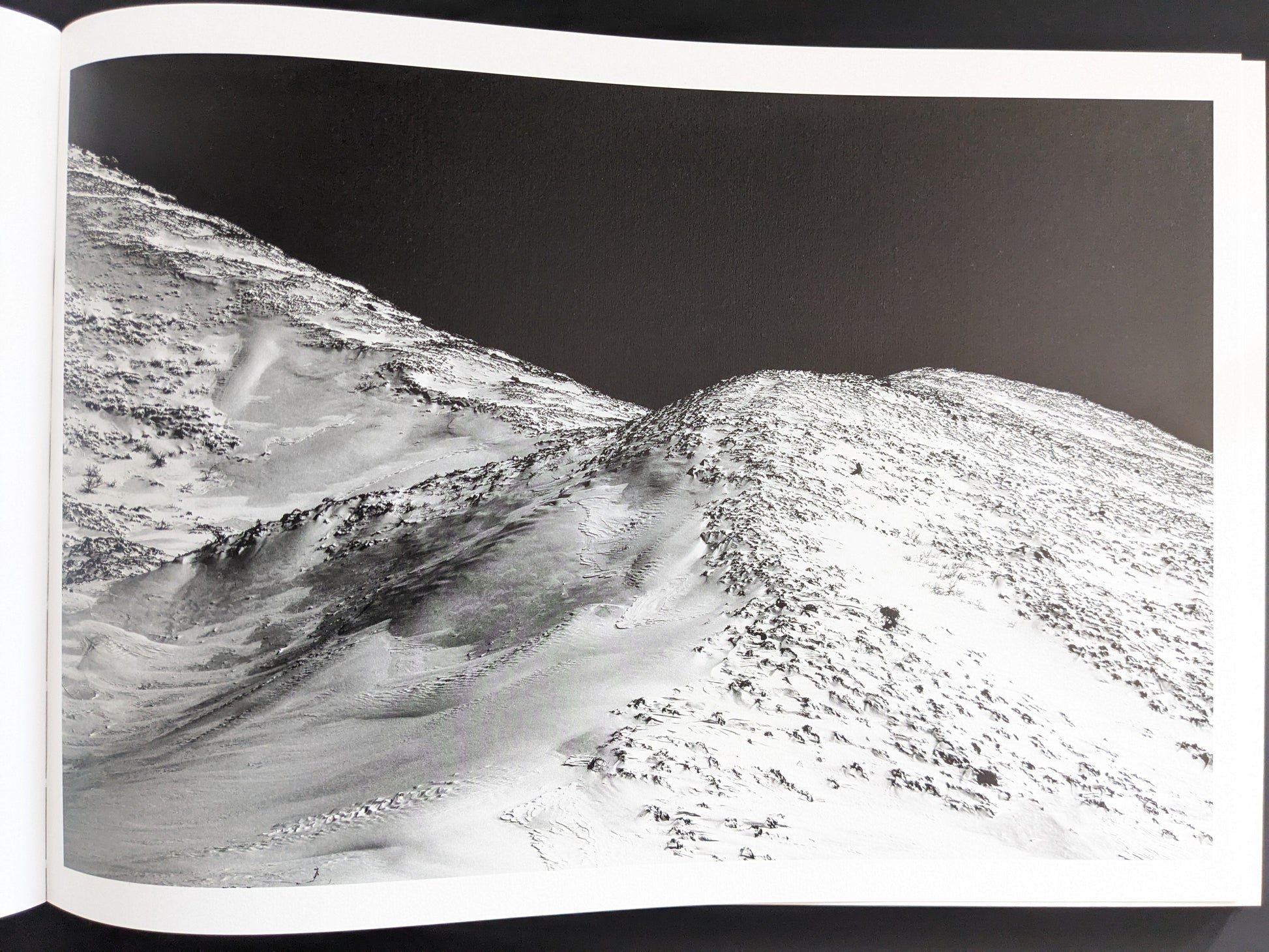 Snow-covered volcanic slope seen from above