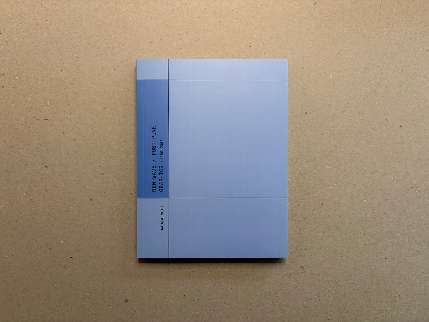 New Wave / Post-Punk Graphics (1980-2000) cover on a tan surface, with a pale blue geometric design and Masala Noir on the spine.