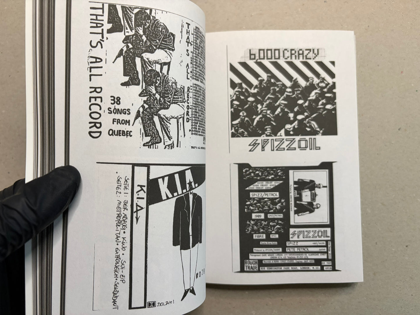 Open spread with hand-drawn and collage-style graphics, including That’s All Record and Spizzoil.