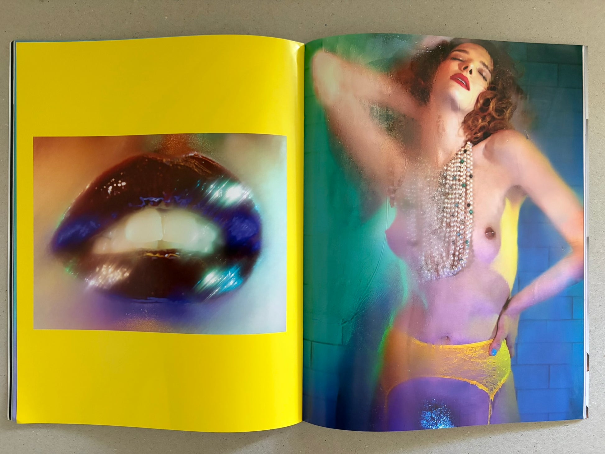 No Erotica No. 5 open to a yellow spread with a close-up lips image and a portrait