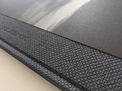 Close-up of the textured spine and interior black-and-white photograph in 'No Fences'