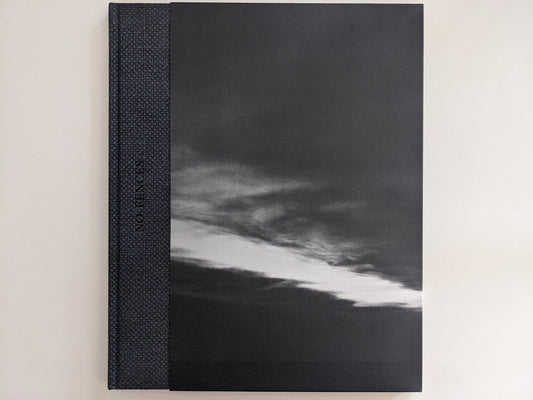 Front cover of 'No Fences' featuring a black-and-white cloud formation over a dark landscape