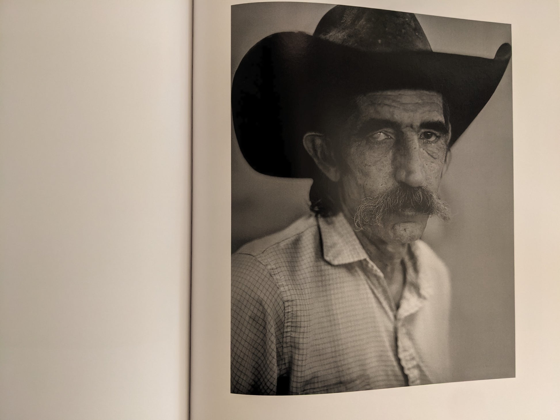 Portrait of cowboy with large hat and mustache from No Fences by Mark McLennan