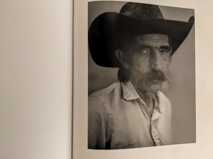 Portrait of cowboy with large hat and mustache from No Fences by Mark McLennan