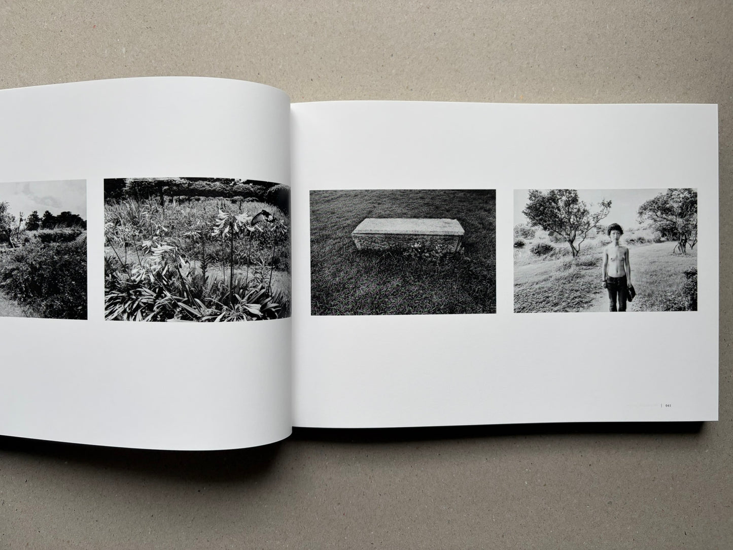 Nobuyoshi Araki, Sentimental Journey 1971–2017, open spread with black-and-white landscape and portrait photographs