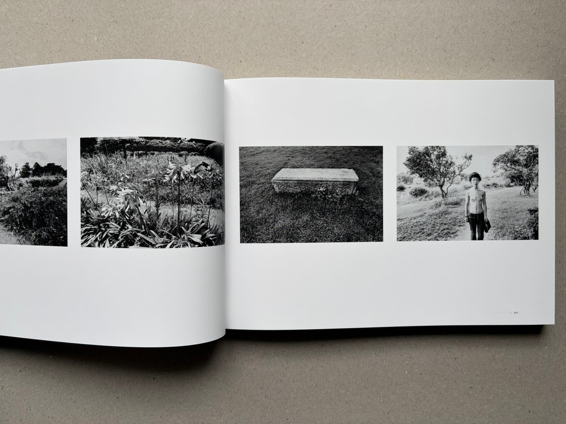 Nobuyoshi Araki, Sentimental Journey 1971–2017, open spread with black-and-white landscape and portrait photographs