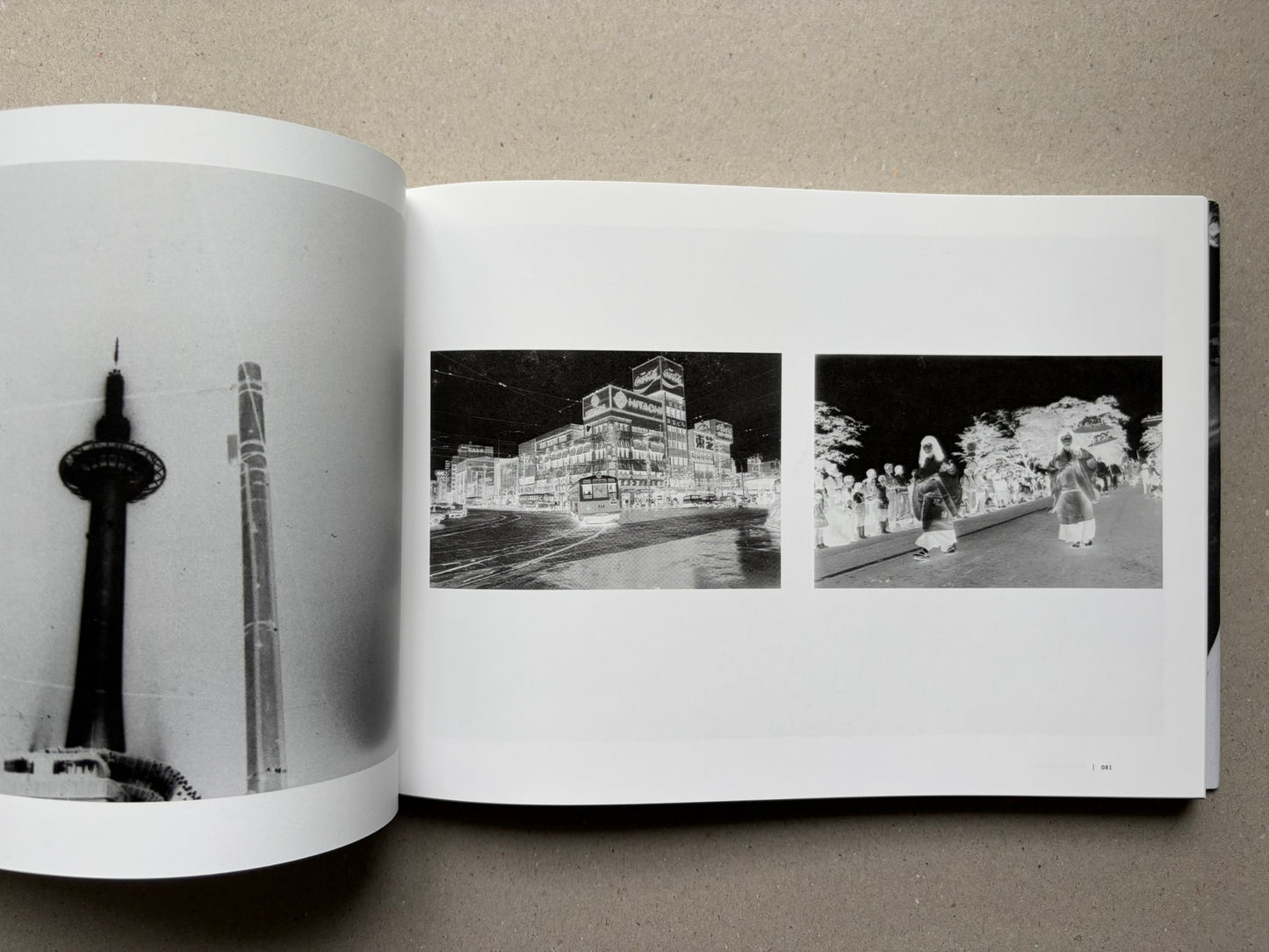 Nobuyoshi Araki, Sentimental Journey 1971–2017, open spread with black-and-white street and skyline photographs