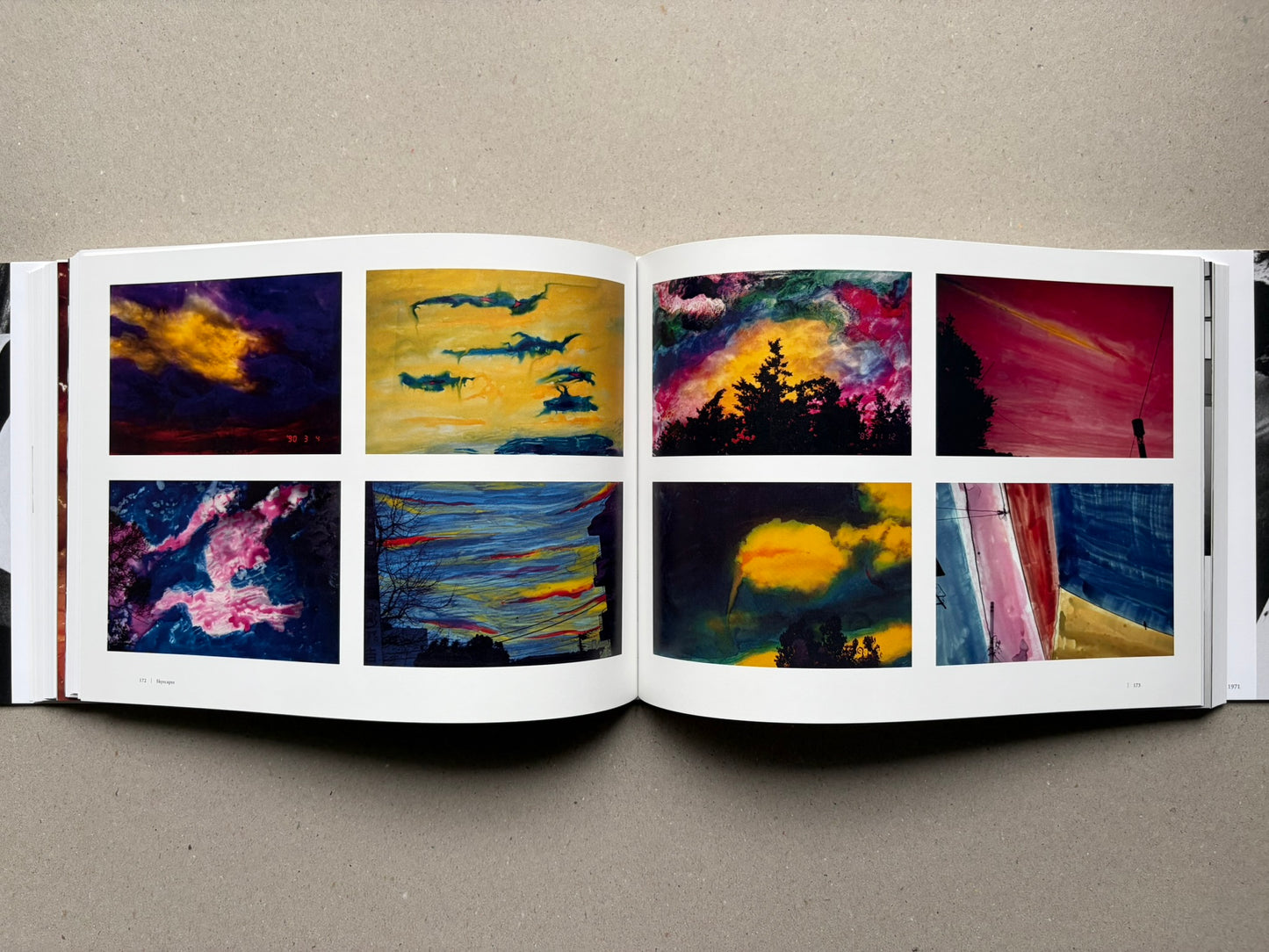Nobuyoshi Araki, Sentimental Journey 1971–2017, open spread with black-and-white photographs and a city scene