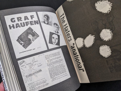 Interior spread with bold German-language graphics and adjacent band artwork.