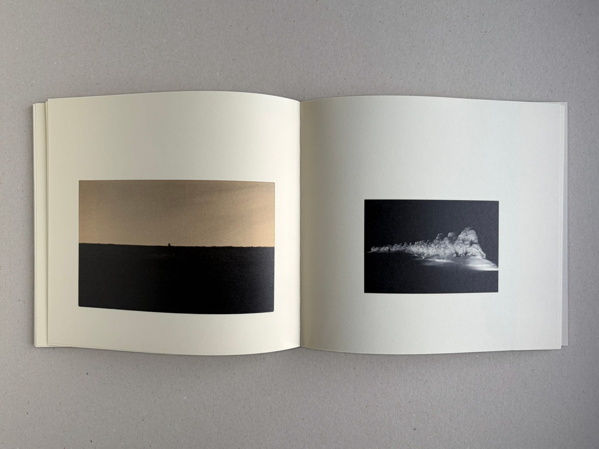 Nusa by Masao Yamamoto, open spread with two landscape photographs