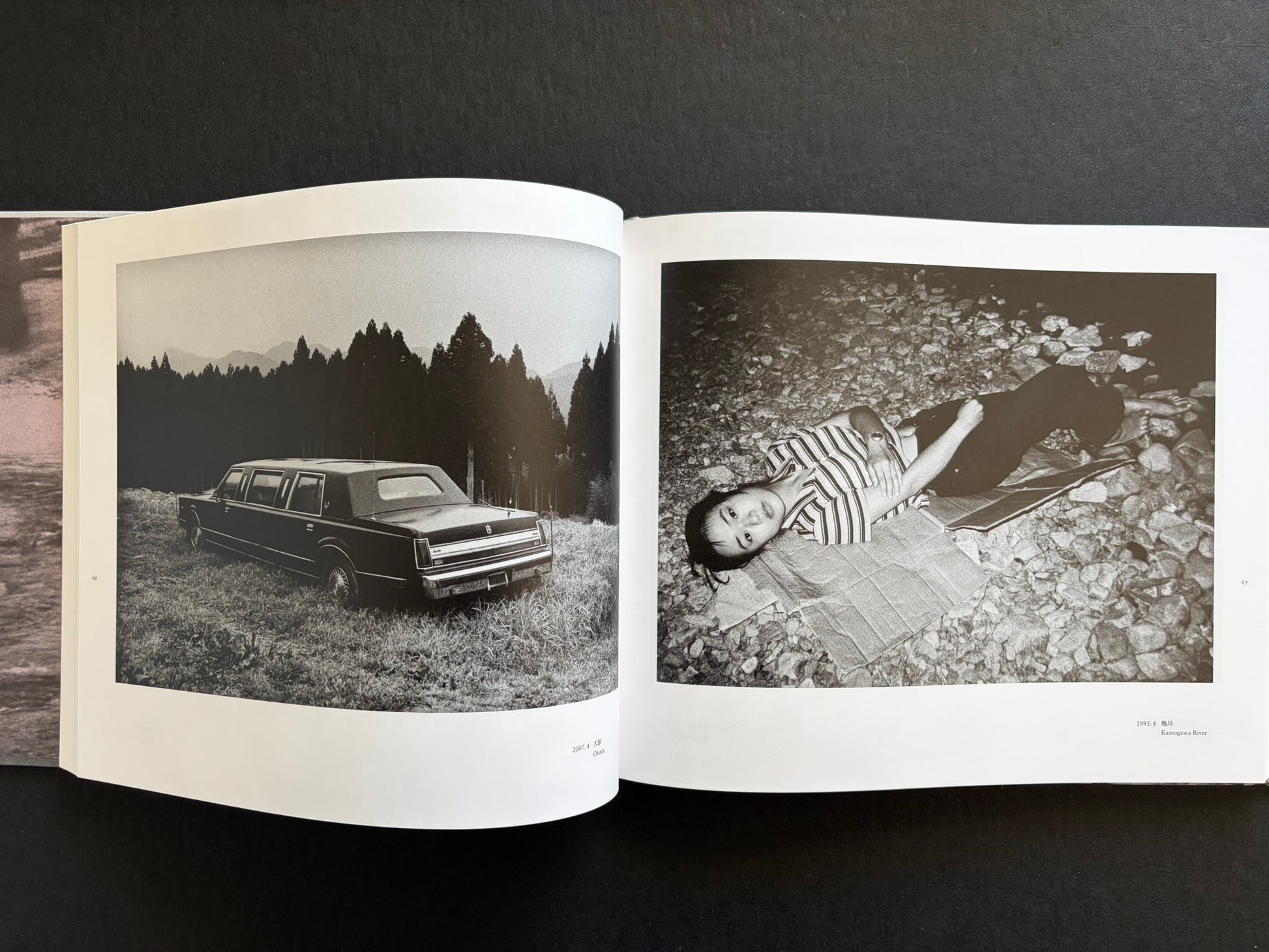 Interior spread with a parked car in a rural landscape and a woman lying by the river at night.