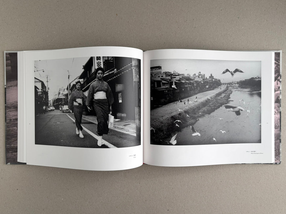 Open spread of Obi and Sand: Kyoto/Enoshima by Yoshio Mizoguchi, showing two black-and-white photographs on facing pages.
