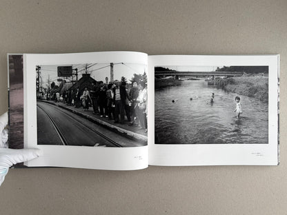 Open spread of Obi and Sand: Kyoto/Enoshima by Yoshio Mizoguchi, showing two black-and-white photographs on facing pages.