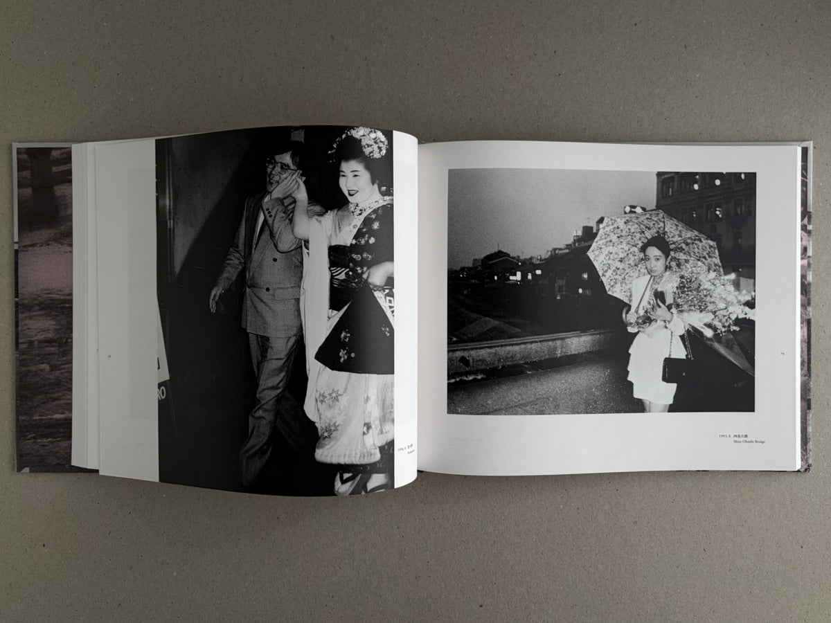 Open photobook spread from Obi and Sand: Kyoto/Enoshima by Yoshio Mizoguchi, showing two black-and-white photographs on facing pages.