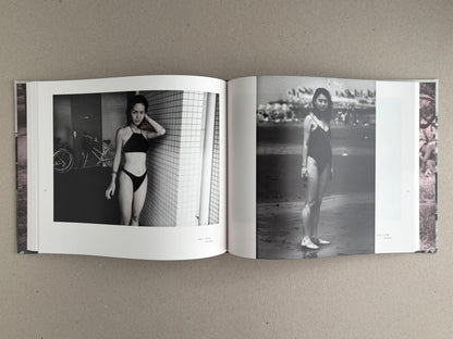 Open spread from Obi and Sand: Kyoto/Enoshima by Yoshio Mizoguchi, showing two black-and-white photographs of women in swimwear.