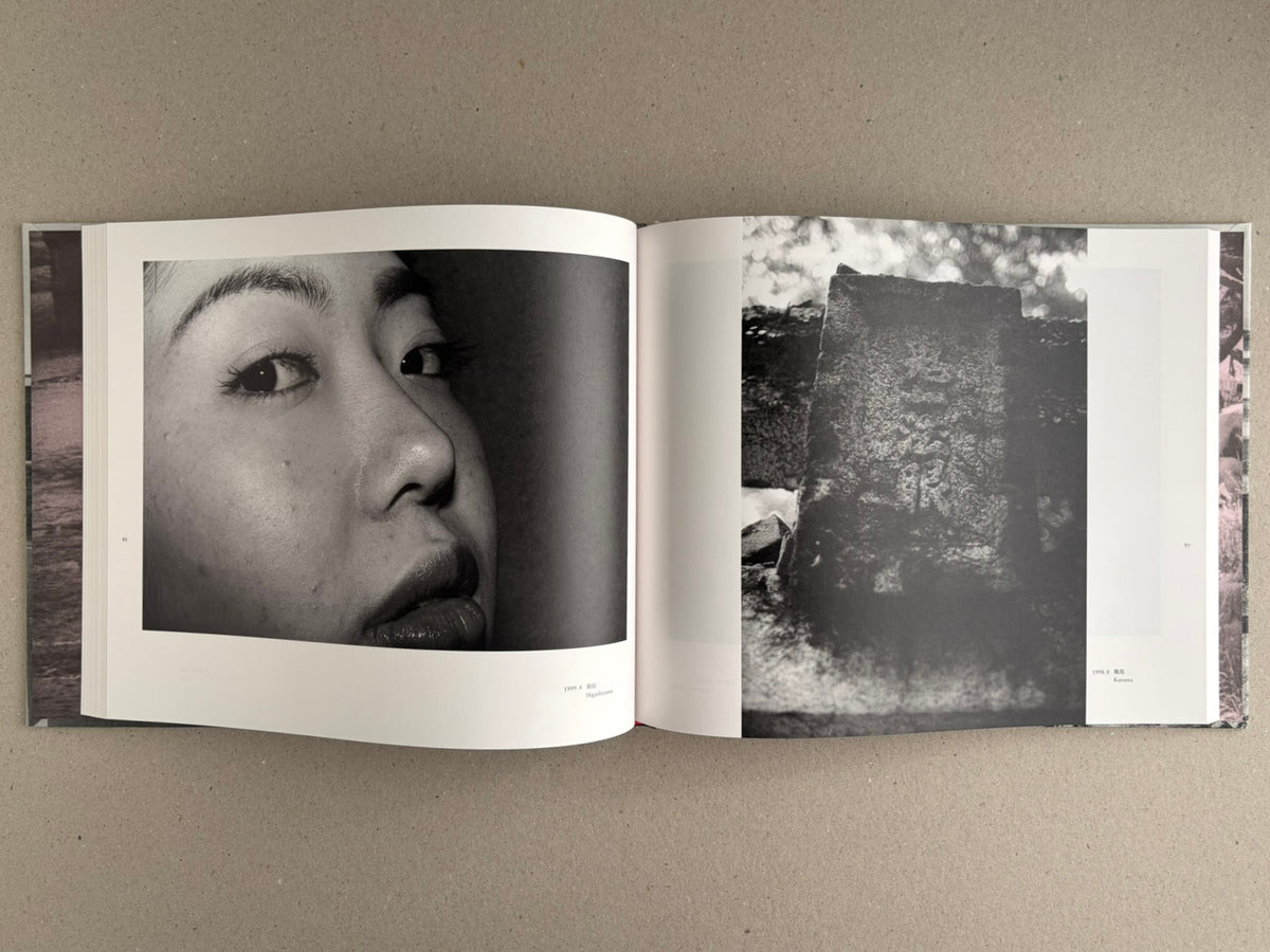 Open spread of Obi and Sand: Kyoto/Enoshima by Yoshio Mizoguchi, showing a close-up portrait on the left page and a dark, textured black-and-white image on the right.