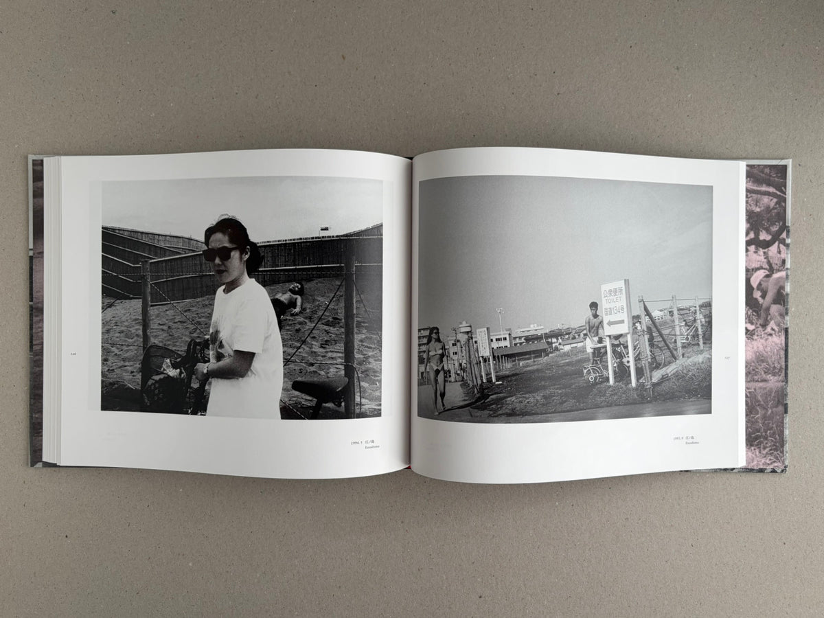 Open spread of Obi and Sand: Kyoto/Enoshima by Yoshio Mizoguchi, showing two black-and-white photographs on facing pages.