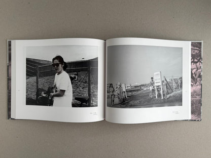 Open spread of Obi and Sand: Kyoto/Enoshima by Yoshio Mizoguchi, showing two black-and-white photographs on facing pages.