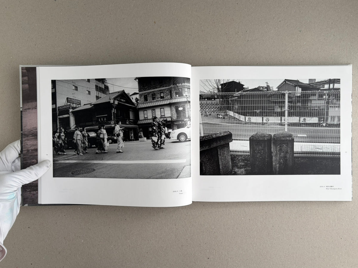 Open spread of Obi and Sand: Kyoto/Enoshima by Yoshio Mizoguchi, showing two black-and-white photographs on facing pages.