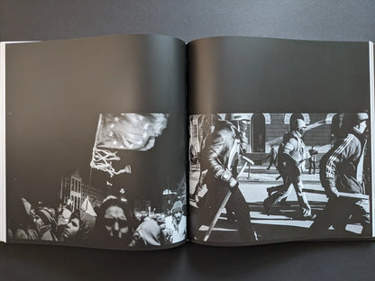 Protest spread from Oleksandr Glyadyelov book showing crowds with an EU flag at night and helmeted demonstrators marching in daylight.