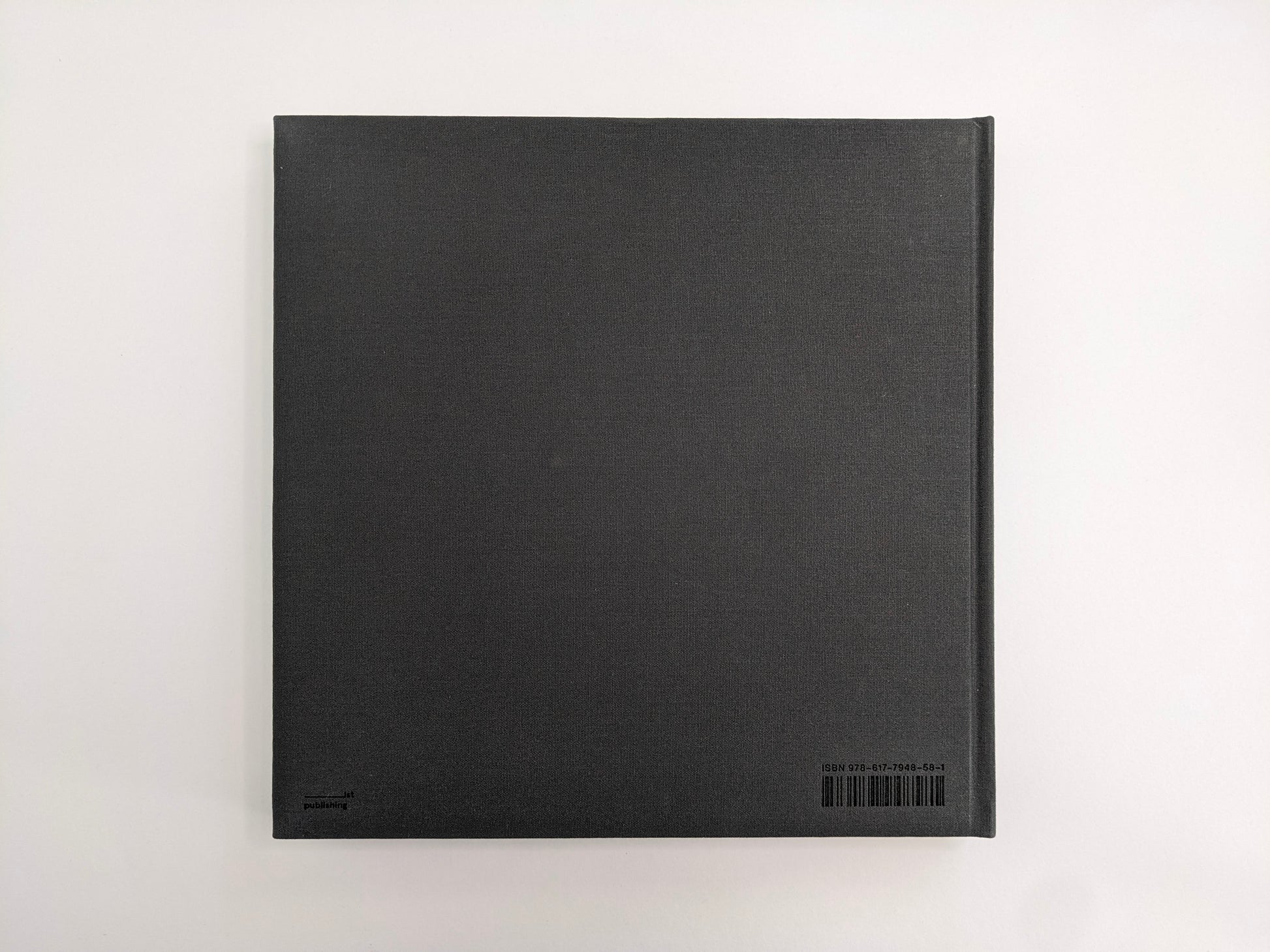 Back cover of Oleksandr Glyadyelov photobook, plain grey cloth hardcover by IST Publishing.
