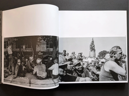 Inside spread from Oleksandr Glyadyelov showing miners and workers gathered in a large protest demonstration.