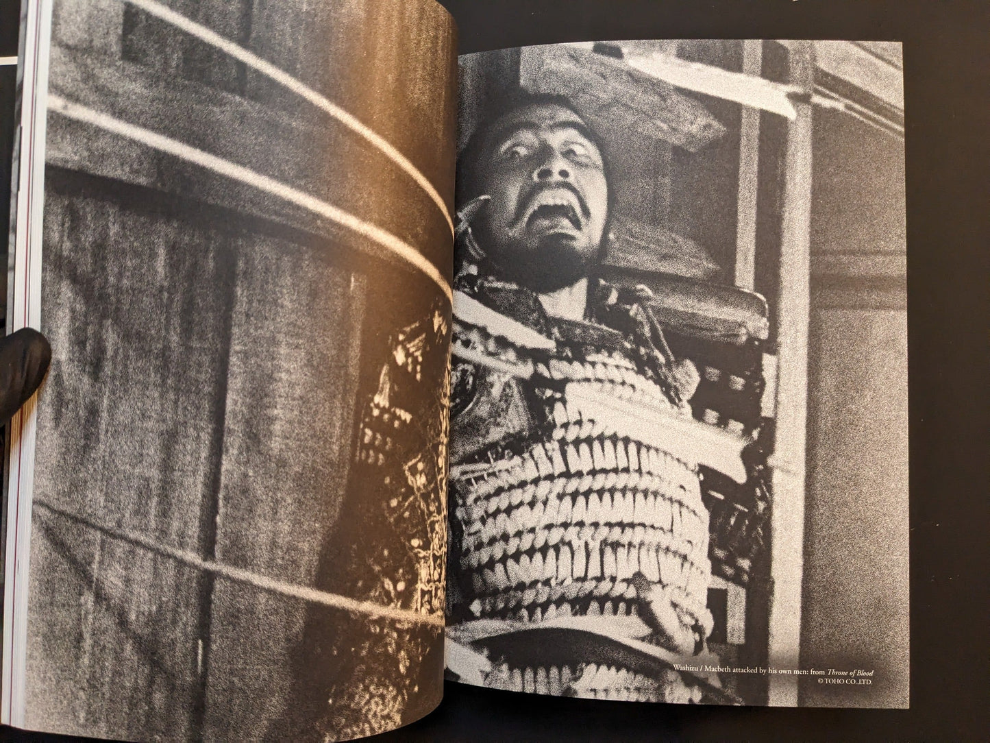Gritty black-and-white film still of a bound figure in armor from “On Kurosawa.”