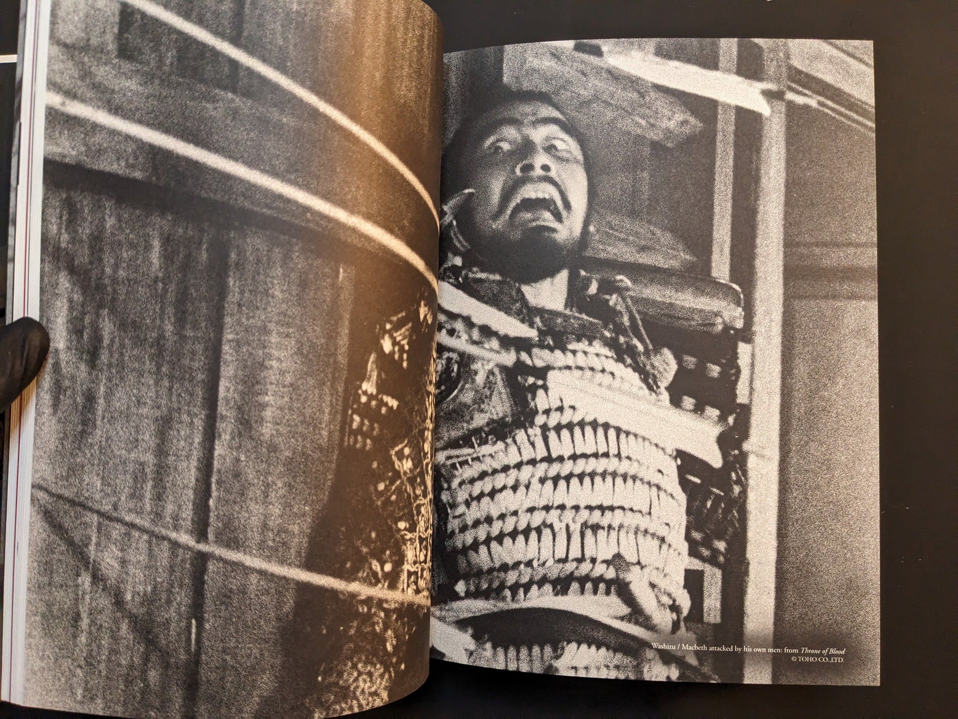 Gritty black-and-white film still of a bound figure in armor from “On Kurosawa.”