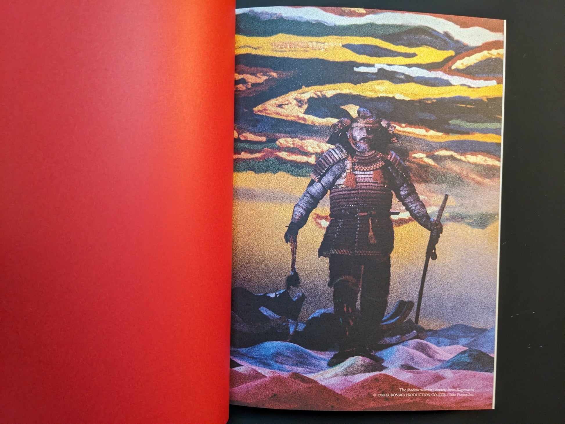 Full-bleed color film still of an armored samurai reproduced in “On Kurosawa.”