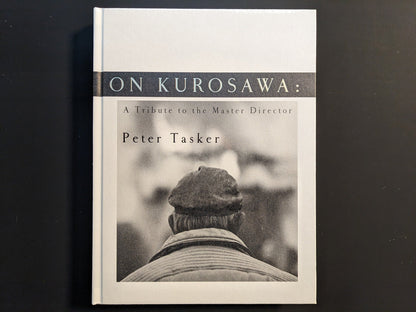 Front cover of “On Kurosawa: A Tribute to the Master Director” by Peter Tasker, hardcover with monochrome portrait design.