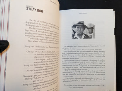 Interior spread: essay ‘Stray Dog’ with text and a small still of Toshiro Mifune and Takashi Shimura, from On Kurosawa by Peter Tasker (Zen Foto Gallery, 2018).