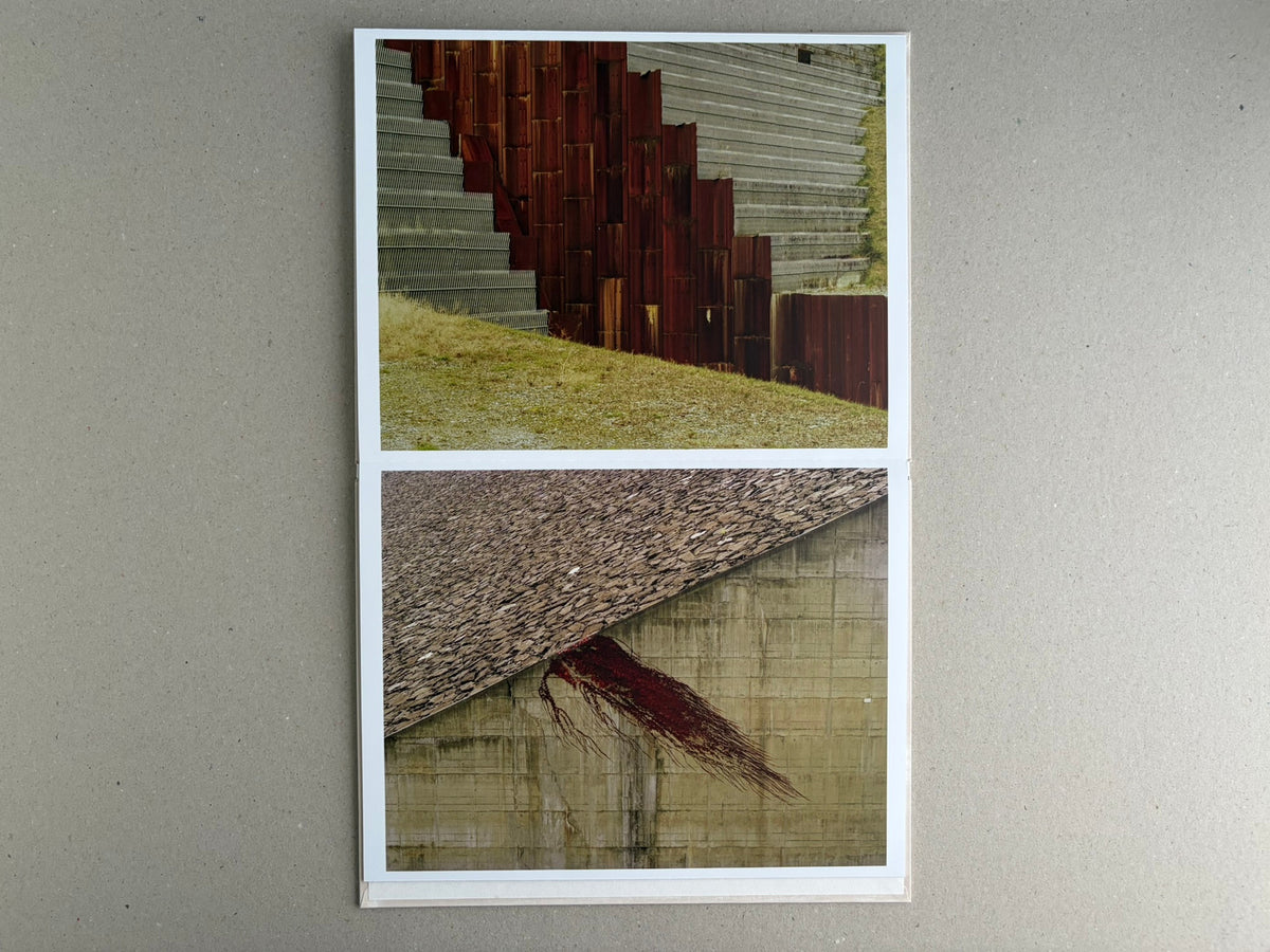Open leporello spread from Painting – Toshio Shibata, showing two landscape photographs with concrete structures and rust-red surfaces.