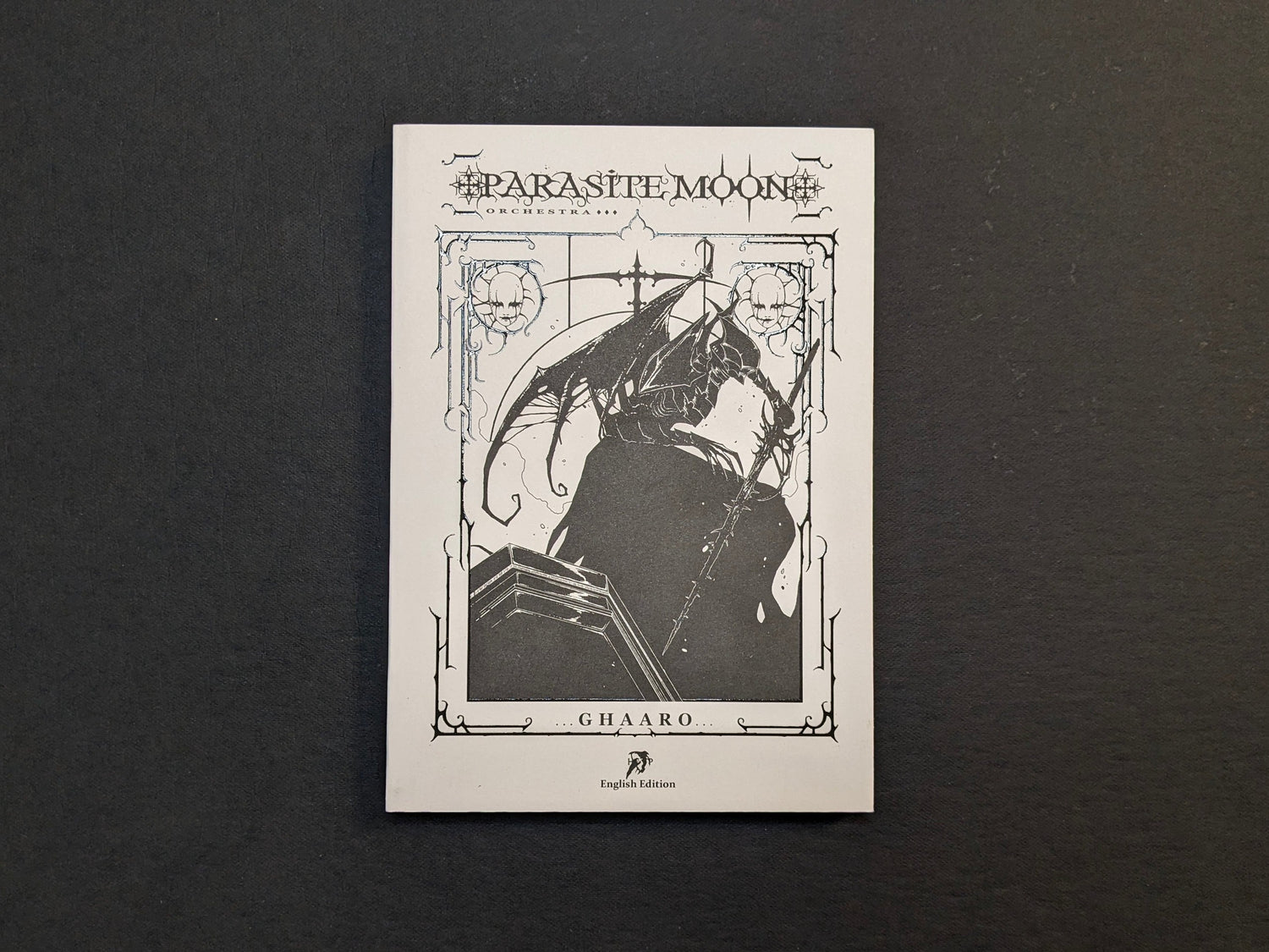 Front cover of the book 'Parasite Moon Orchestra' by Ghaaro, showing a gothic, surreal illustration in black and white.
