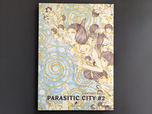 Front cover of 'Parasitic City #2' by Shintaro Kago, featuring surreal bodies in a swirling reincarnation motif.