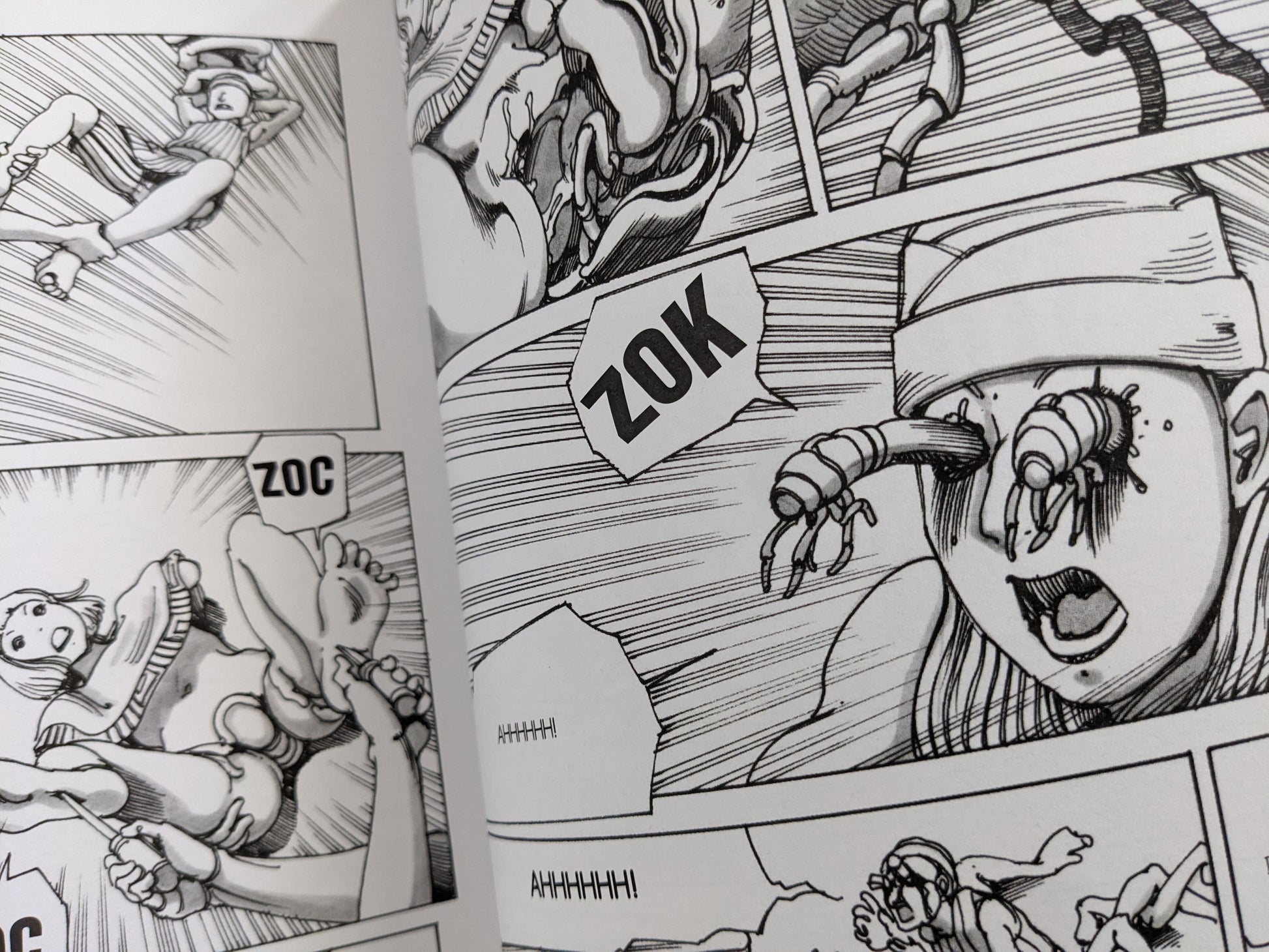 Graphic page from 'Parasitic City #2' with grotesque parasite creatures bursting from a character’s eyes.