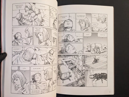 Interior spread with two characters talking in a hospital bed and a beetle-like parasite on the floor.