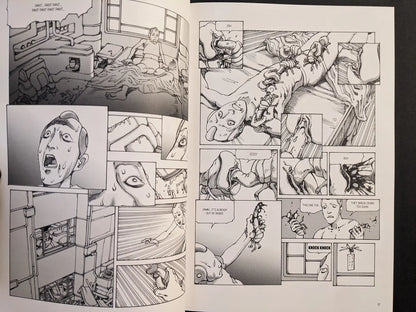 Interior spread from “Parasitic City #3” with a restrained patient covered by segmented parasites in a clinical room, drawn in grey-scale.