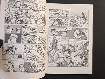 Interior spread from “Parasitic City #3” showing soldiers in a rocky landscape attacked by worm-like parasites in black-and-white manga panels.