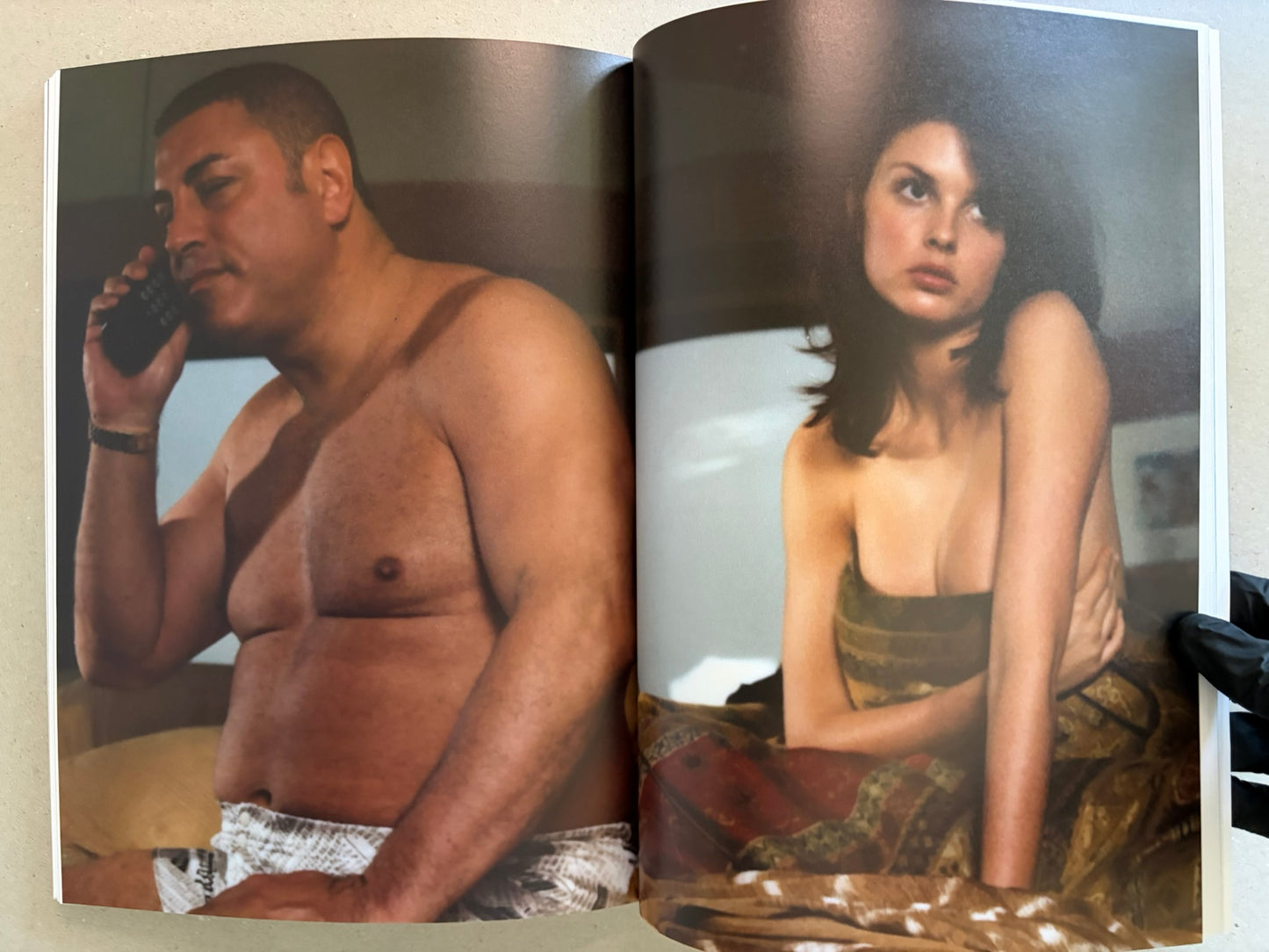 Open spread with a shirtless man on the left and a woman in lingerie on the right.
