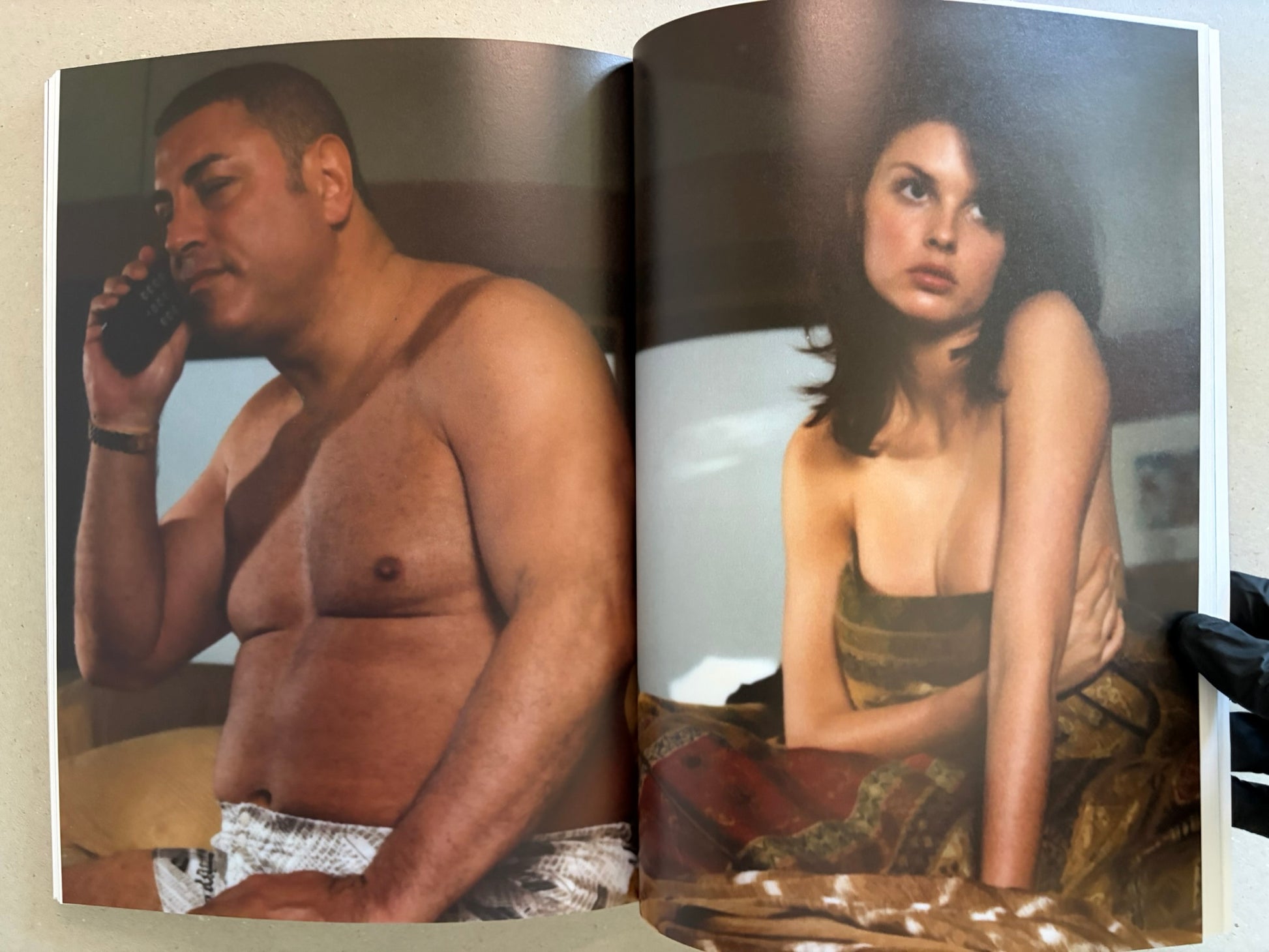 Open spread with a shirtless man on the left and a woman in lingerie on the right.