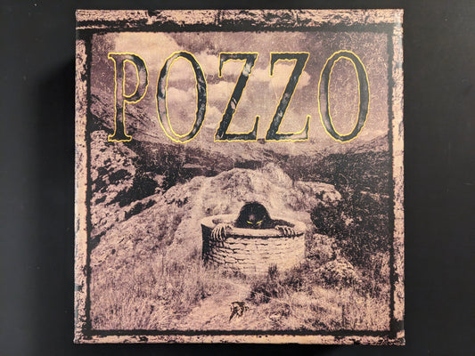 Front view of the POZZO board game box by Hollow Press with dark horror-themed artwork.