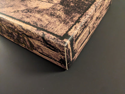 Close-up of the POZZO board game box corner showing minor wear and texture.