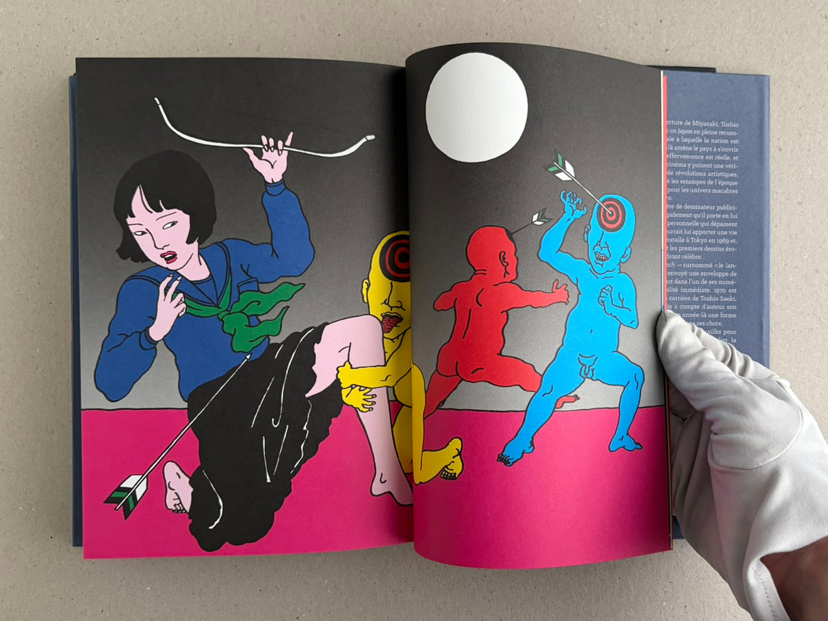 Rêve écarlate by Toshio Saeki open to a dark spread with a figure in white and a figure hanging upside down.