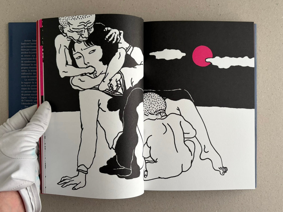 Rêve écarlate by Toshio Saeki open to a black-and-white illustrated spread with a pink moon on the right page.