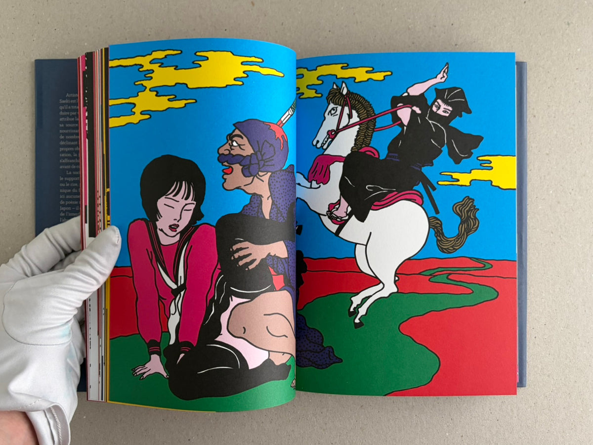 Rêve écarlate by Toshio Saeki open to a blue spread with illustrated figures on horseback and on the ground.