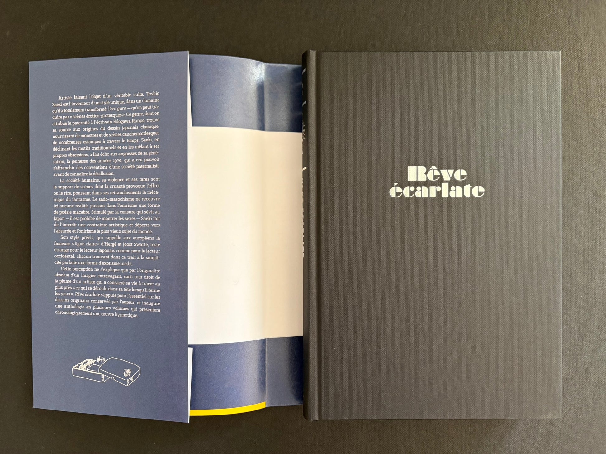 Rêve écarlate opened with the dust jacket and hardcover shown side by side