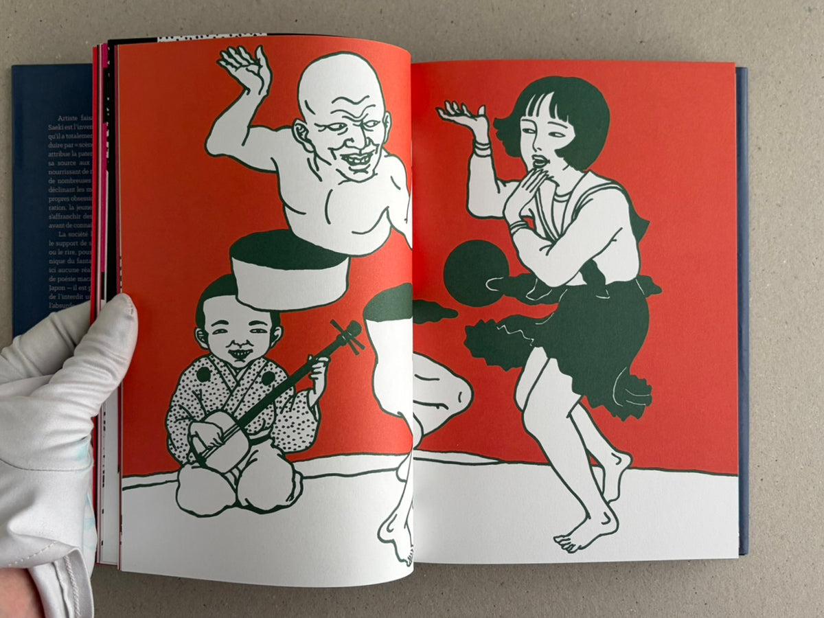 Rêve écarlate by Toshio Saeki open to a red spread with multiple illustrated figures.
